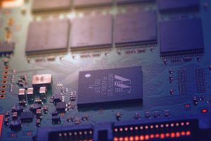 Micro chips installed on a PCB with other electronic devices on it.